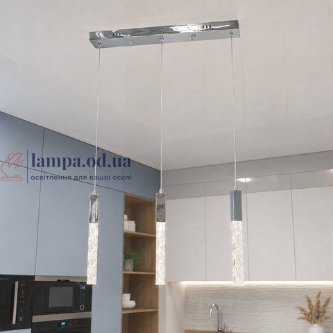Лінійна срібляста LED люстра на 3 прозорі підвіси Artlight 2350/3SL над столом 2350/3SL фото